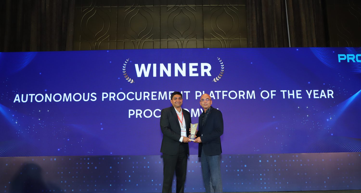 Proconomy receiving Autonomous Procurement Platform of the Year on stage, the summit screen behind reading Winner, Autonomous Procurement Platform of the Year, Proconomy.ai