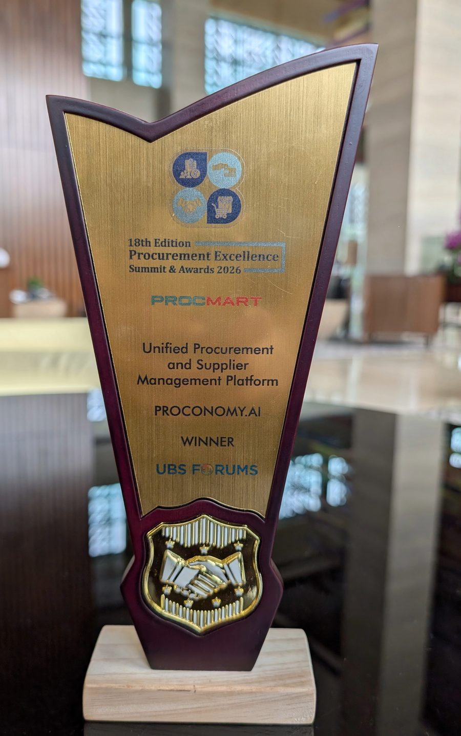 Engraved trophy reading Unified Procurement and Supplier Management Platform, Proconomy.ai, Winner, UBS Forums, 18th Edition Procurement Excellence Summit and Awards 2026