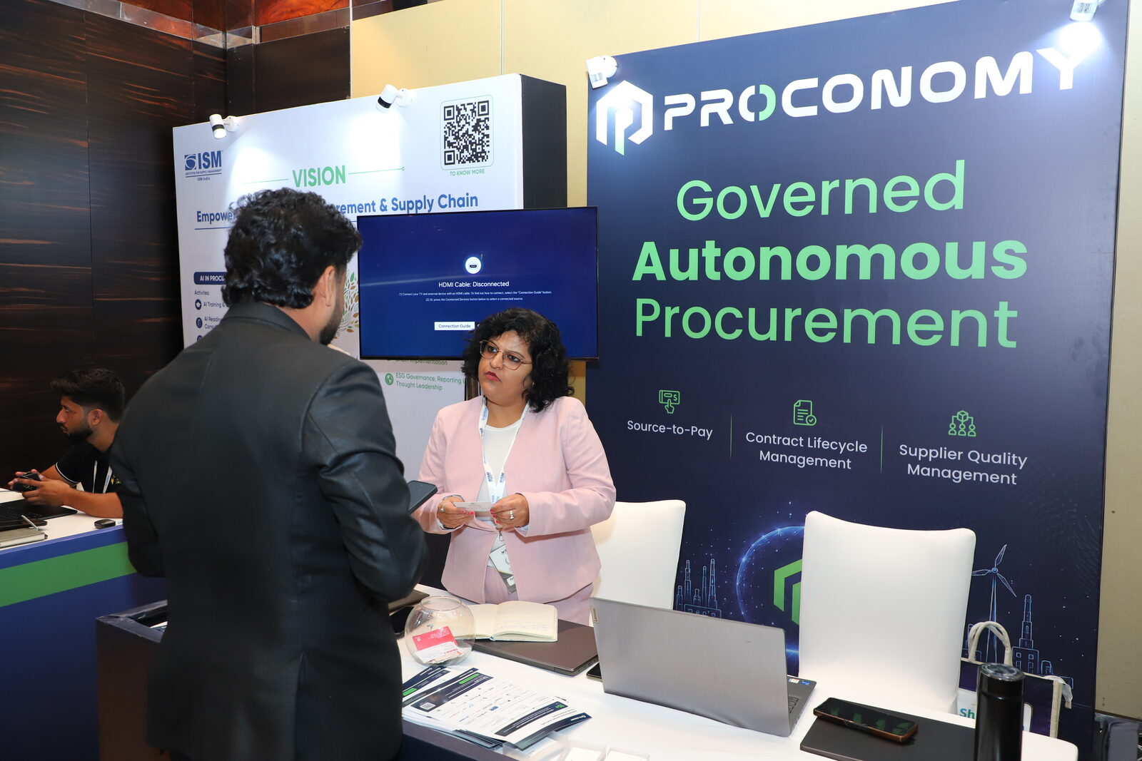 The Proconomy team talking with a visitor at the Proconomy stand, 11th Annual ISM-INDIA Conference & Awards 2026